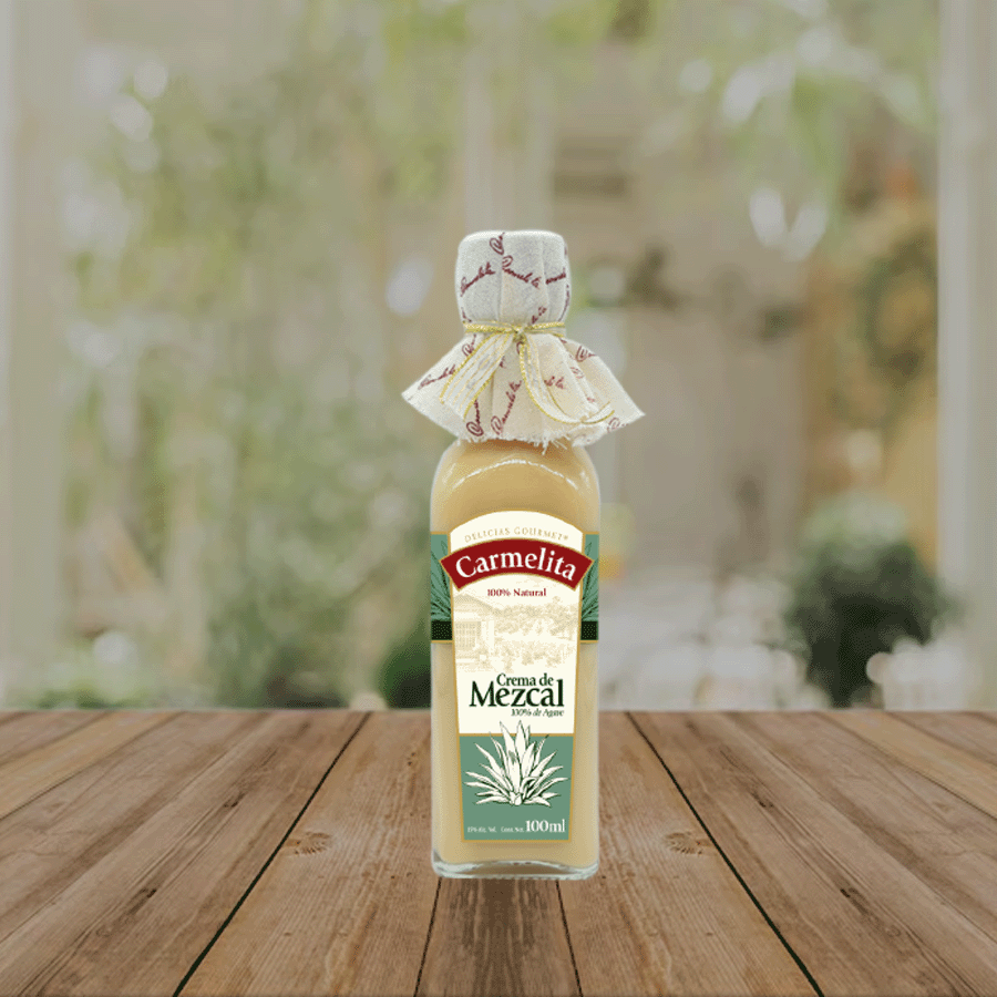 Botella de Crema de Mezcal Carmelita 100 ml, bebida artesanal mexicana de sabor suave y cremoso, ideal para regalar o disfrutar fría.